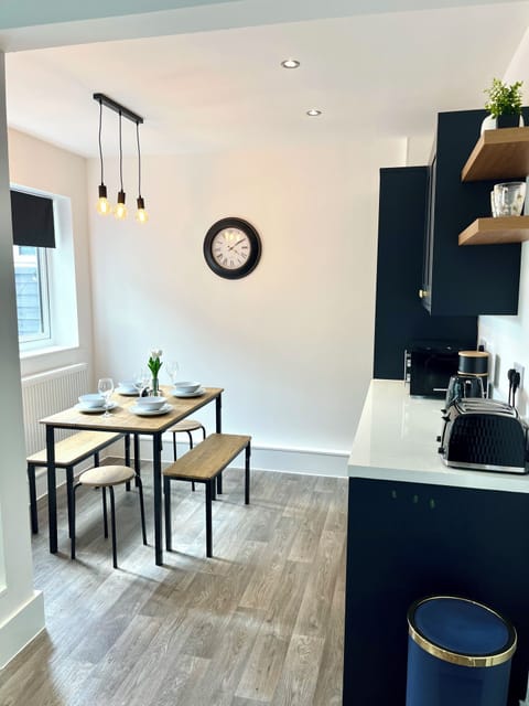 Bright, spacious dining area with table that can seat up to 6 people.