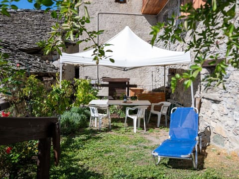 Plant, Property, Furniture, Table, Chair, Shade, Outdoor Furniture, Outdoor Table, Building, Cottage