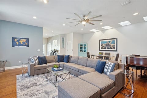 A cozy, spacious, modern living room with plush seating for relaxation.