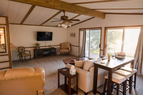 Living Room – Cozy, spacious, and full of lake views! 🛋️✨