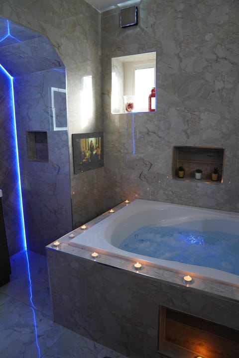 Apartment | Bathroom | Combined shower/tub, deep soaking tub, towels, toilet paper