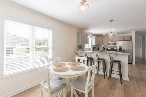 The large kitchen also has a small table and bar seating as well as a pantry to store all your groceries!