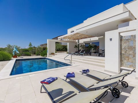 Furniture, Swimming Pool, Outdoor Furniture, Chair, Resort, Home, Composite Material, Estate, Shade, Landscaping