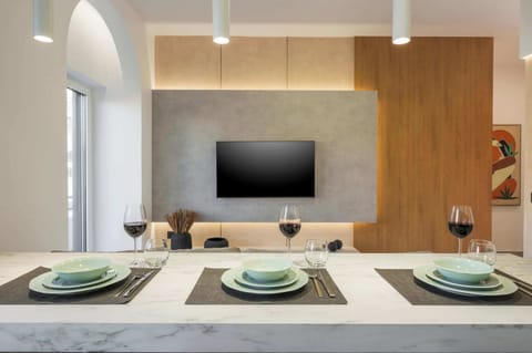 Sleek Media Wall and Designer Dining Space