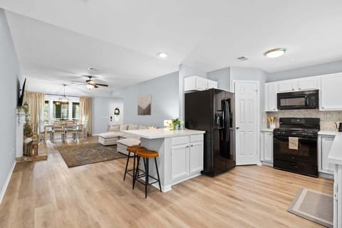 Kitchen open to the living area and has a small table top for others to hang out and chat.