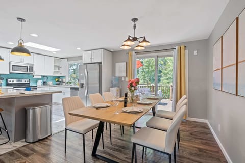 Living area with large windows, providing a serene view and plenty of light