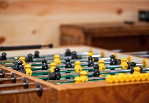 A friendly game of foosball awaits! Perfect for some laid-back fun with family and friends.