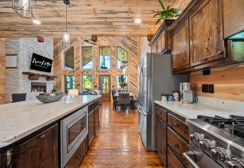 This open-concept space is perfect for entertaining, with the kitchen flowing seamlessly into the living and dining areas.