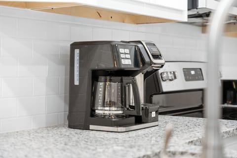 Coffee nook with modern appliances for a fresh morning brew.
