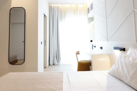 Deluxe Triple Room, Balcony, Sea View | In-room safe, blackout drapes, soundproofing, iron/ironing board