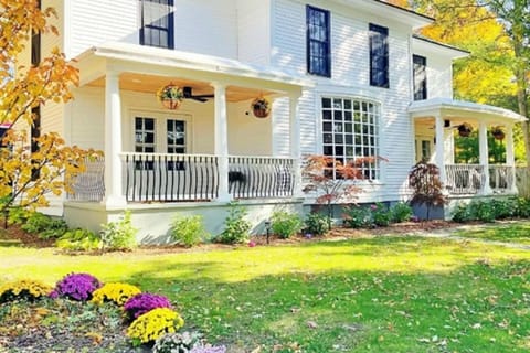 Experience historic charm and vibrant garden views with our beautifully maintained Victorian-style home in Saugatuck, MI.