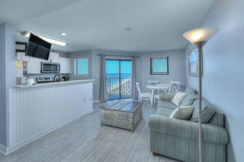 Relax in the comfort of a well-appointed living room with an ocean view.