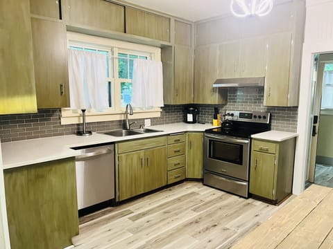 Fully stocked kitchen! Original sturdy cabinets with updates counter tops!