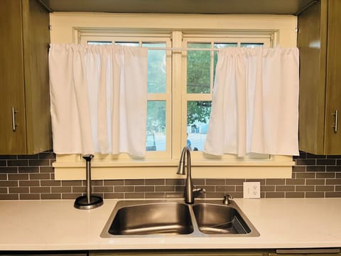 Kitchen sink looking out to the side yard! Usually with views of kids playing!