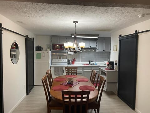 Fully stocked kitchen with room for dining.