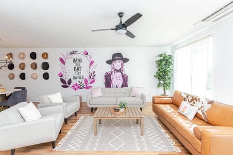 Living room with Lainey Wilson mural