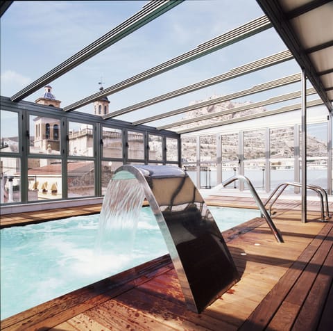 Indoor pool, pool umbrellas, sun loungers