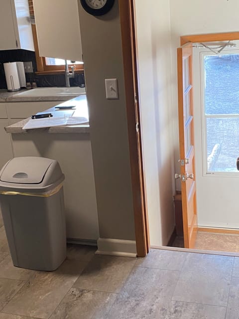 Back door to fenced in backyard.  Includes propane grill with side burner