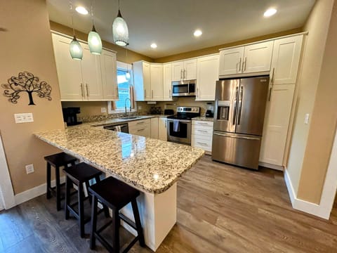 Fully stocked kitchen. Granite. Stainless steel appliances. Spacious. 