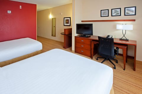 Desk, blackout drapes, iron/ironing board, free cribs/infant beds