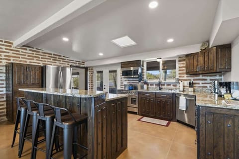 The kitchen has quick access to the back patio