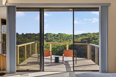 Enjoy a cup of morning coffee on the private master suite balcony.