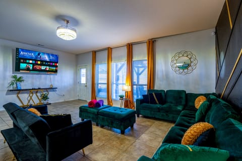 Gatsby Manor offers ample seating for you and your guests as well as a 75" TV