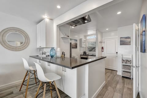 A sleek kitchen with a spacious island
