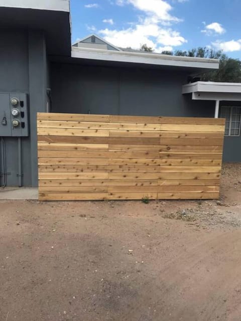 Your door is just beyond this fence.  