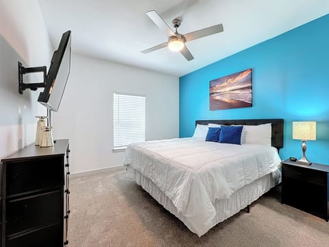 Unwind in Style: Retreat to our expansive bedroom featuring a king-size bed.