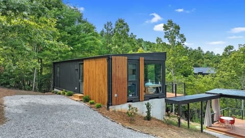 Modern container cabin with mountain views and upscale neighborhood setting.