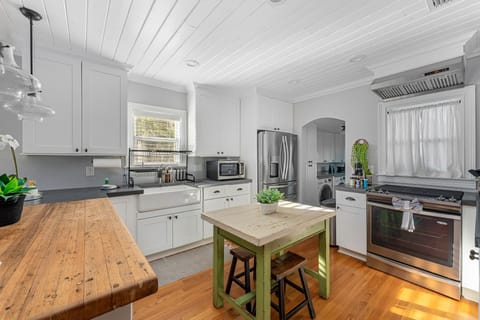 Full kitchen with stainless appliances and gas stove