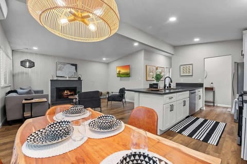 a welcoming space dedicated to meals and gatherings. It typically features a central dining table surrounded by chairs, with enough seating to accommodate family members.