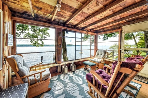 Sun room with 4 comfy glider rocking chairs.