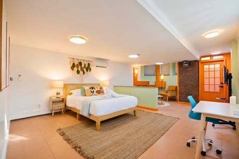 Bedroom includes a small workspace area, ideal for remote work or quiet reading.