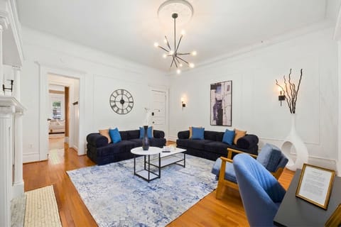 Feel the comfort of the sofas, surrounded by stylish white and black accents