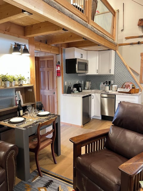 Saw marked wood floors downstairs with cozy area rugs.