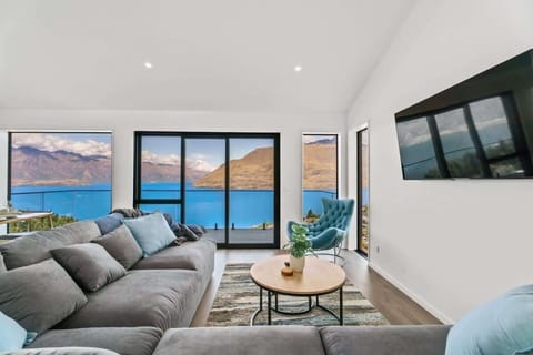 Truly spectacular views of Lake Wakatipu, the Remarkables and the surrounding mountains from the open plan living room, dining and kitchen.