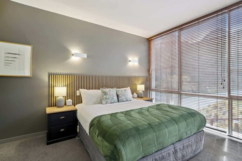 Spacious bedroom featuring a plush king-size bed