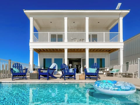 Newly built, this stunning home features a heated pool & breathtaking views.