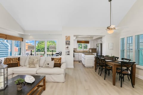 Living room with gas fireplace, cable TV, and balcony access