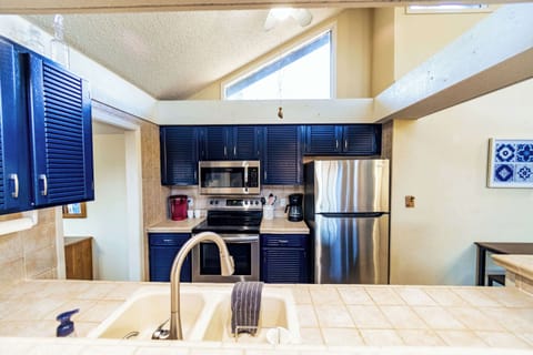 The airy, open kitchen offers ample space & all the comforts of home