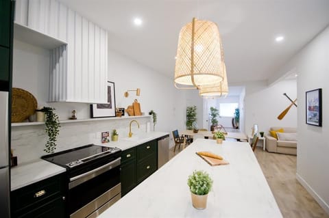 Modern kitchen with elegant finishes and stylish lighting, fully equipped for your stay.