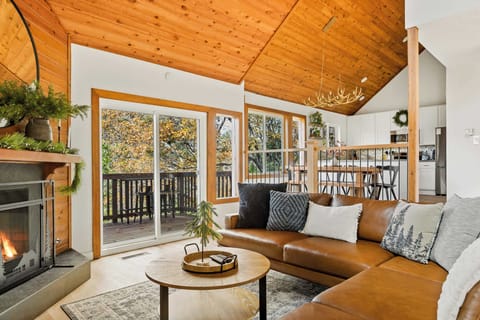 Cozy up by the living room  gas fireplace and enjoy the forest views.