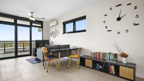 Bright and airy living space with sleek finishes, oversized windows, and modern minimalist charm.