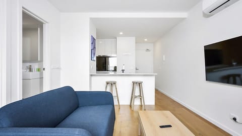 Bright and modern open-plan living with sleek finishes and natural light throughout.