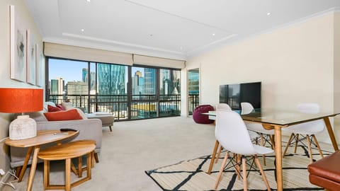 Expansive open-plan living with breathtaking skyline views and natural light.