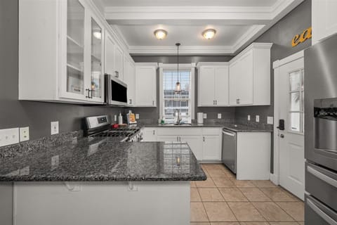 Kitchen with basic oils, spices and cooking utensils