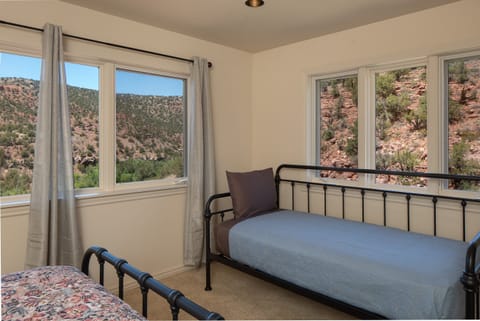 Bedroom 4: Queen bed plus a twin, ideal for a small group or family.