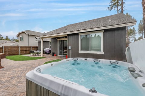 Outdoor Fun with Hot Tub & Fire Pit: Relax in the backyard oasis with a brand-new hot tub, fire pit, hammock, and BBQ grill.
